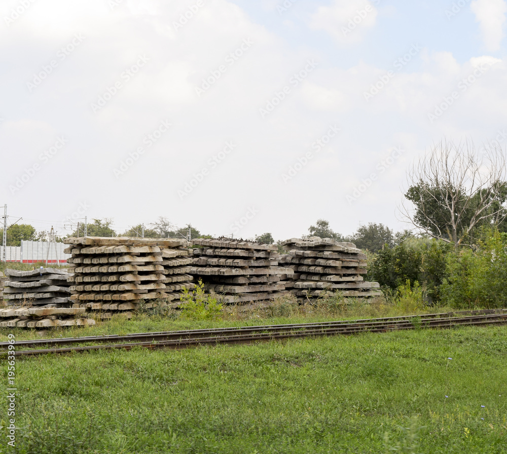 Concrete sleepers near the railway. Repair of rails.