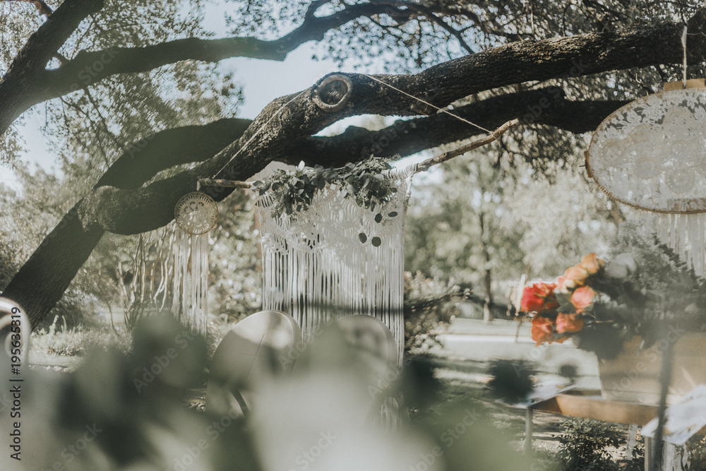 Naklejka premium Macrame hanging on Tree at Garden Party