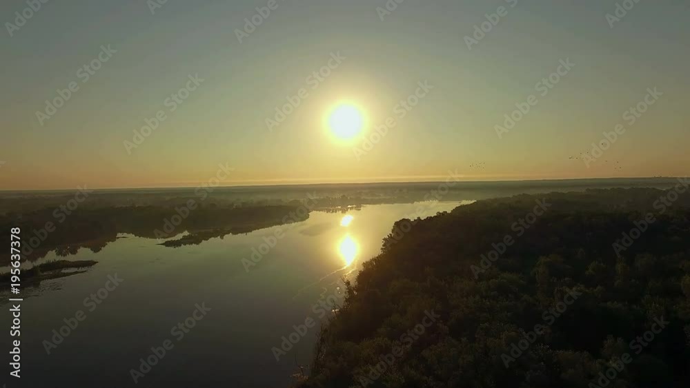 aerial view of river at sunrise 4K, forest and river in morning mist, Very high view of the river forest at sunrise, Aerial view of mystical river at sunrise with fog, sun above the river aerial aerial view of river at sunrise 4K, forest and river in morning mist, Very high view of the river forest at sunrise, Aerial view of mystical river at sunrise with fog, sun above the river aerial