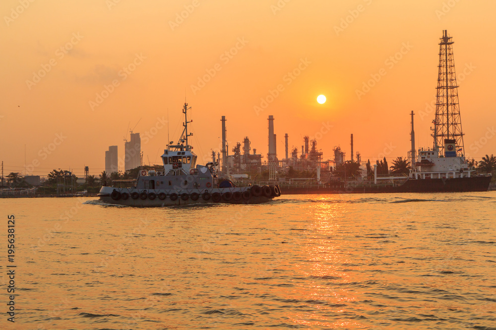Oil refinery at the river in sunrise time / Big Factory in sunrise time