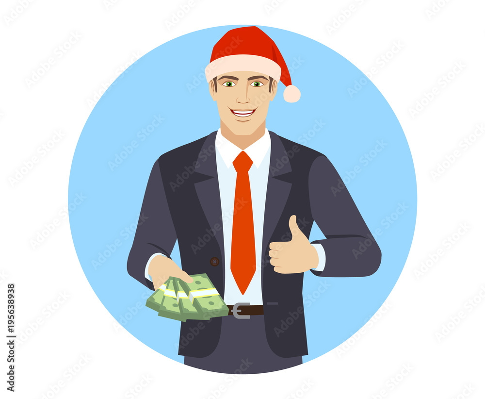 Businessman in Santa hat with money shows thumb up Businessman in Santa hat with money shows thumb up