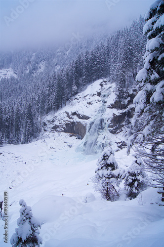 Frozen waterfall with rock © jankost
