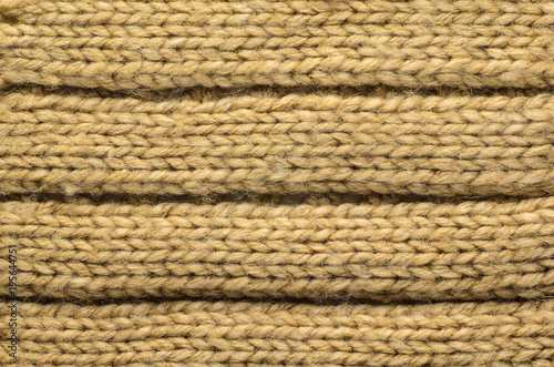 Knit texture of wool knitted fabric with regular pattern as background