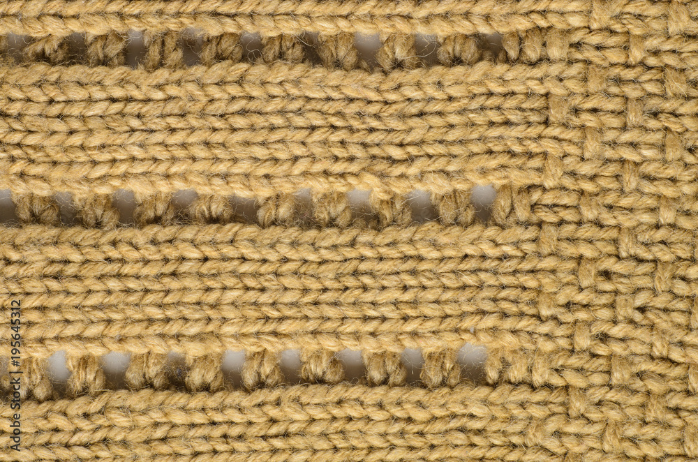 Beige Texture of a Knitted Sweater with Two Types of Knitting. Knit texture as background. Beige Texture of a Knitted Sweater with Two Types of Knitting. Knit texture as background.