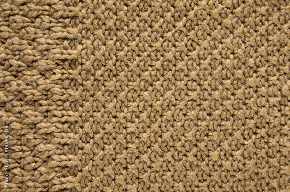 Beige Texture of a Knitted Sweater with Two Types of Knitting. Knit texture as background. Beige Texture of a Knitted Sweater with Two Types of Knitting. Knit texture as background.