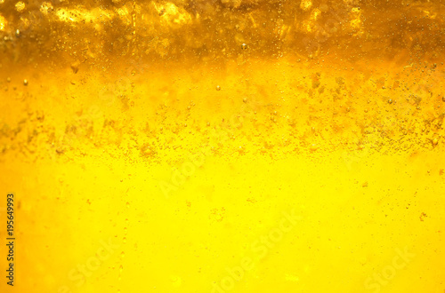 tasty liquid background of fresh Golden honey glistens in the sun