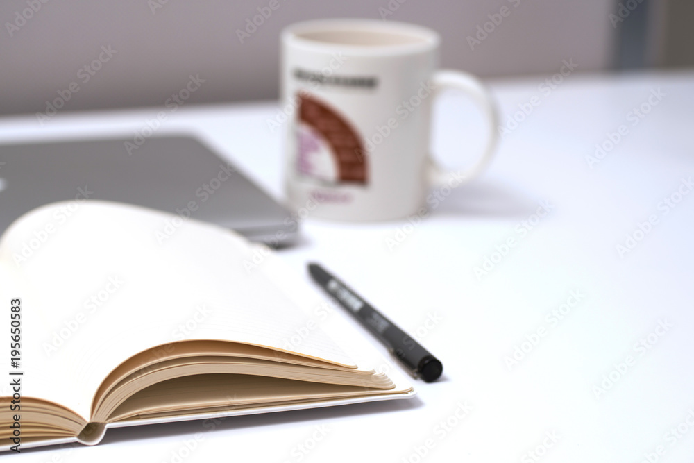 Notebook, pen and Laptop on White background Notebook, pen and Laptop on White background