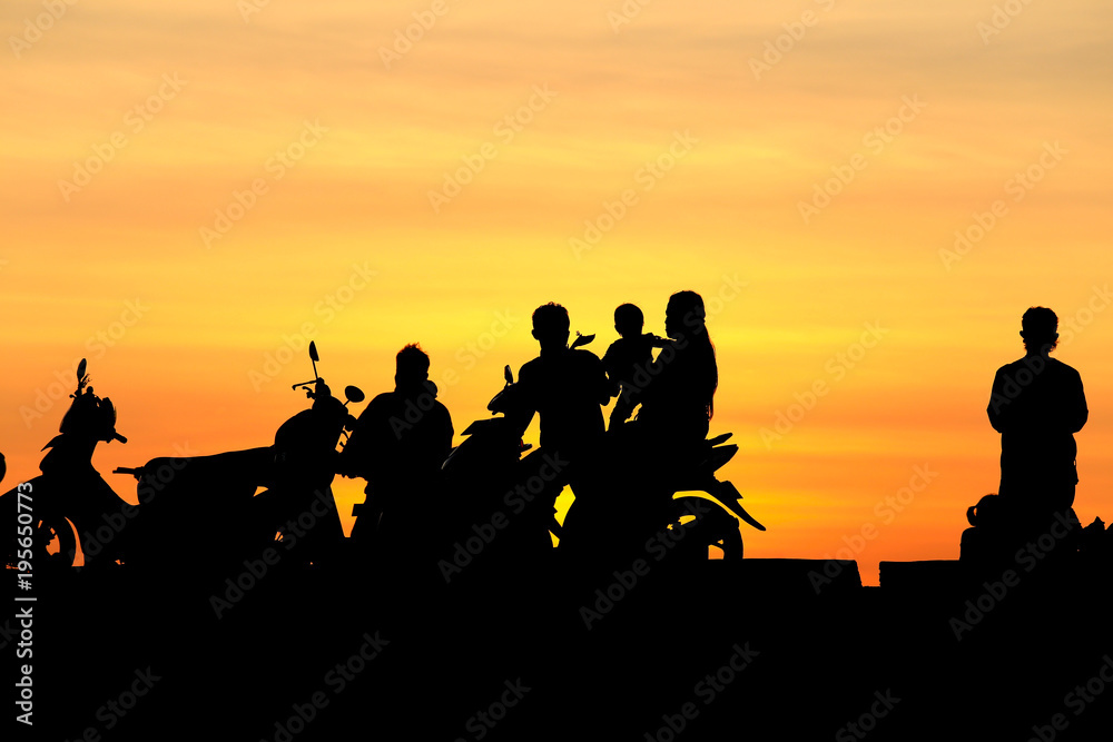 Silhouette people and family on motorcycle at sunset, silhouette photo
