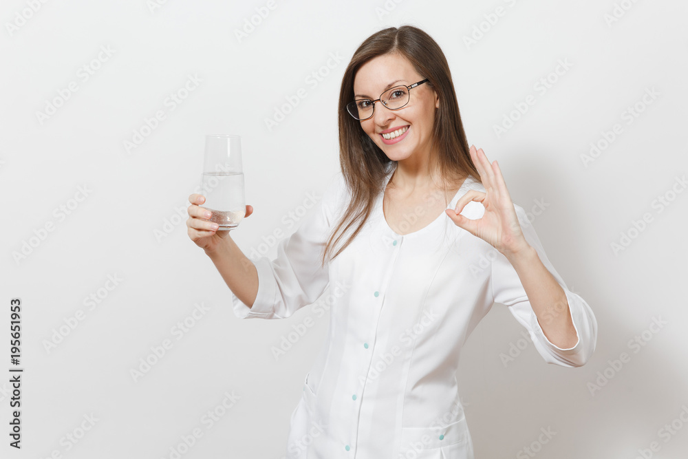 Smiling beautiful doctor woman isolated on white background. Female doctor in white medical gown, glasses holding glass of water, showing OK gesture. Healthcare personnel, health, medicine concept. Smiling beautiful doctor woman isolated on white background. Female doctor in white medical gown, glasses holding glass of water, showing OK gesture. Healthcare personnel, health, medicine concept.