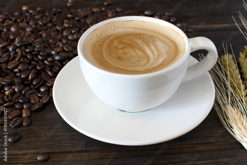 Coffee Cup and Beans on Wooden Table Coffee Cup and Beans on Wooden Table
