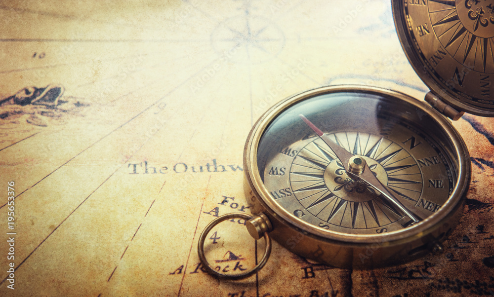 Magnetic compass on world map.Travel, geography, navigation, tourism and exploration concept background. Macro photo.