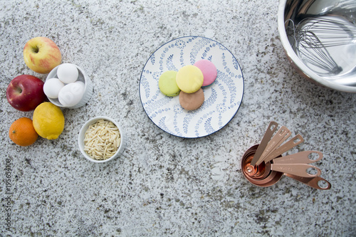 fruit and egg ingredients with macaroon in kitchen