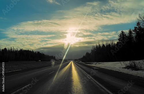 Sunflare over a northern highway.