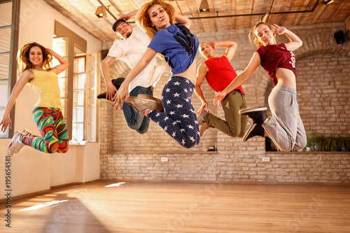 Group of dancers jumping together