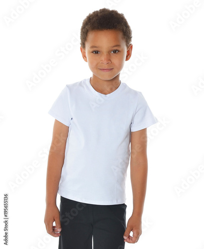 Cute boy in white t-shirt and black shorts on white background. Sport children. Atlethic kids. fitness boy. Mixed kids. Smiling boy. 