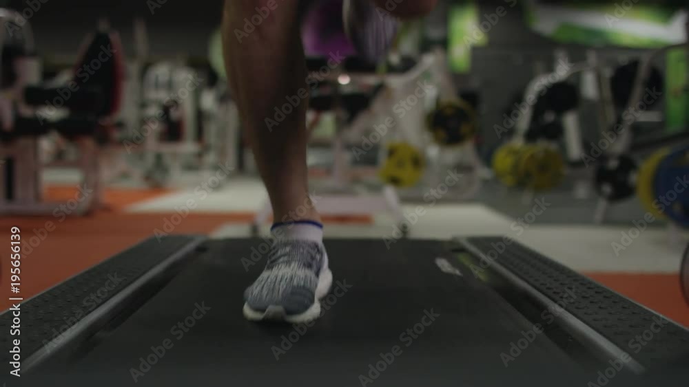 Close up of legs running on treadmill Close up of legs running on treadmill