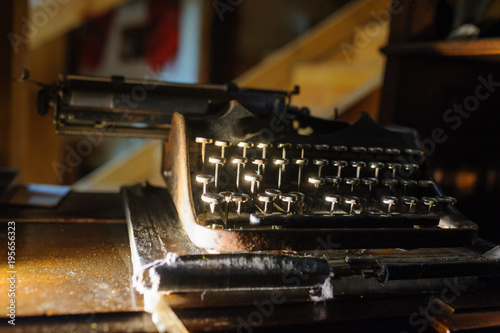  vintage typewriter on the desk full of cobweb