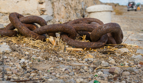 Old rusty abandoned chain 