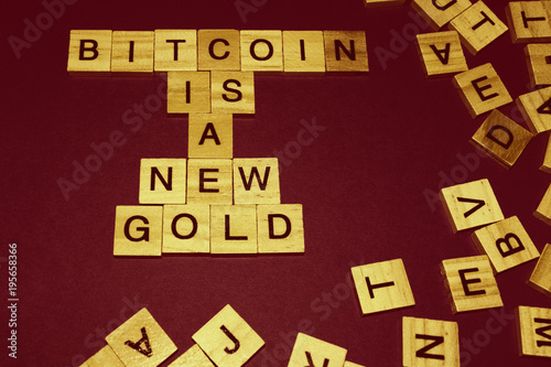 Wooden blocks on a brown background spelling words Bitcoin Is A New Gold