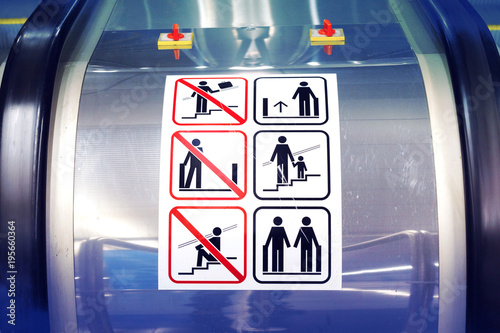 Signs on the escalator. Warning signs on the escalator in the metro