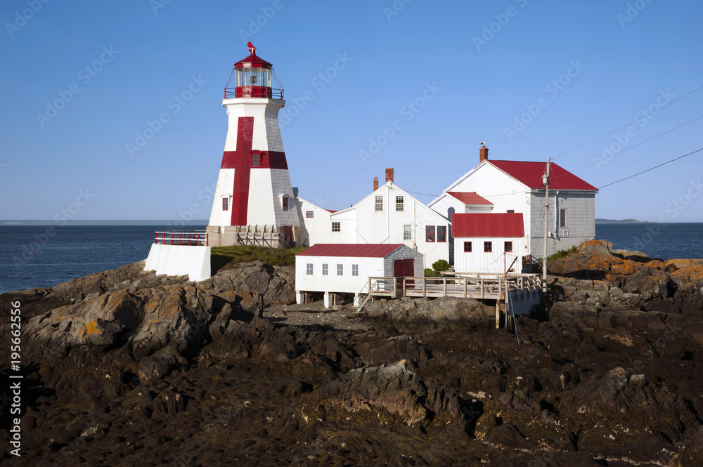 Canadian Lighthouse with Painted Cross During Low Tide on Campobello Island Canadian Lighthouse with Painted Cross During Low Tide on Campobello Island