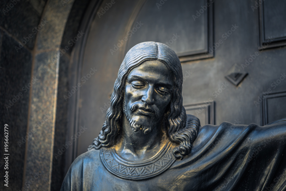 Buenos Aires - July 01, 2017: Religious statue at the Recoleta cemetery in Buenos Aires, Argentina Buenos Aires - July 01, 2017: Religious statue at the Recoleta cemetery in Buenos Aires, Argentina