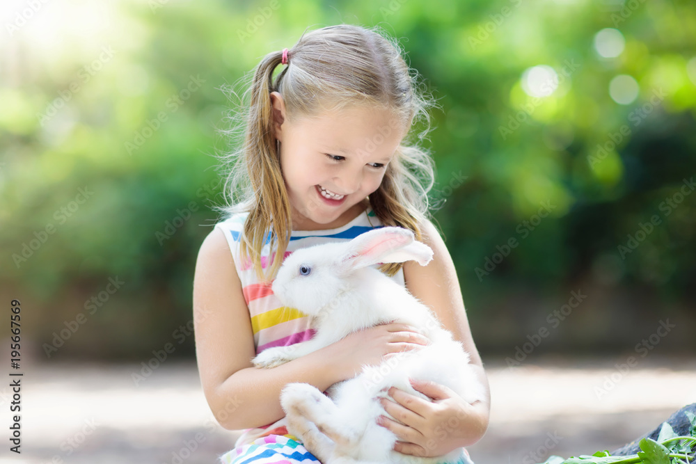 Child with rabbit. Easter bunny. Kids and pets. Child with rabbit. Easter bunny. Kids and pets.