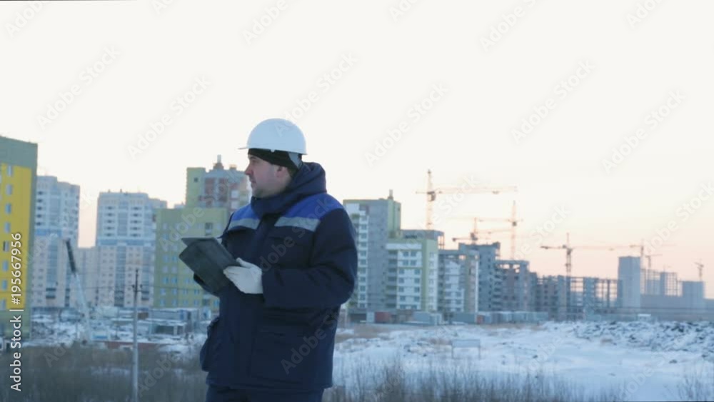 Foreman with pad at major construction project Foreman with pad at major construction project
