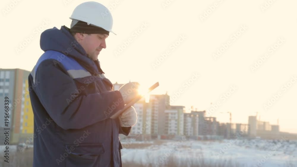 Foreman with tablet at major construction project Foreman with tablet at major construction project