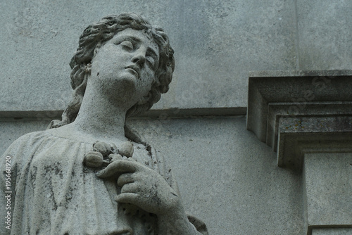 gravestones with stone angels and women tombstones