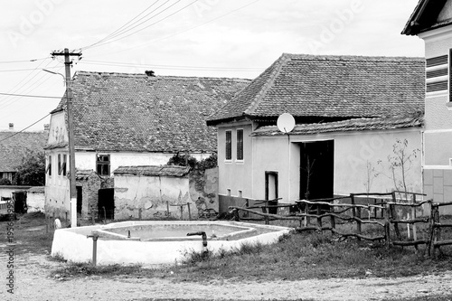 Typical rural landscape and peasant houses in Barcut, Bekokten, Brekolten, Transylvania, Romania. The settlement was founded by the Saxon colonists in the middle of the 12th century photo