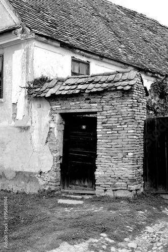 Typical rural landscape and peasant houses in Barcut, Bekokten, Brekolten, Transylvania, Romania. The settlement was founded by the Saxon colonists in the middle of the 12th century photo
