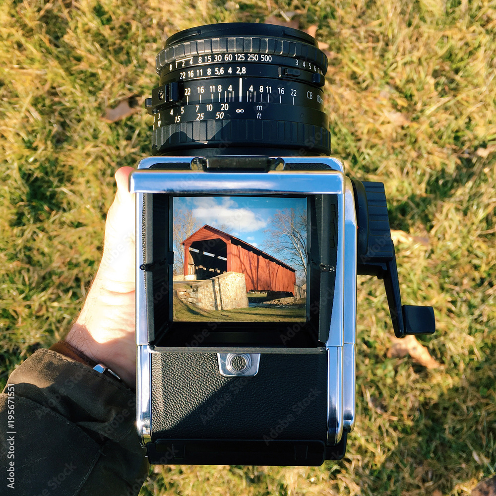 A view down the waist level viewfinder of a classic medium format camera. Stock Photo Adobe Stock