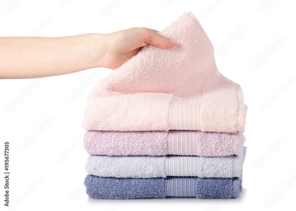 A stack of towels pink blue in hand A stack of towels pink blue in hand