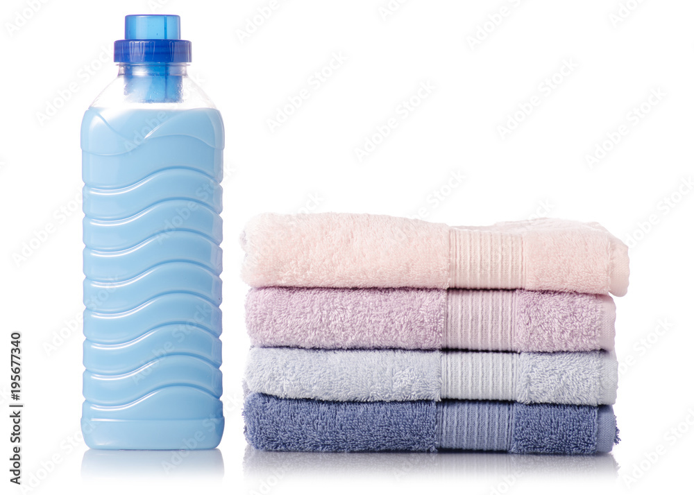 A stack of towels softener conditioner liquid laundry detergent A stack of towels softener conditioner liquid laundry detergent