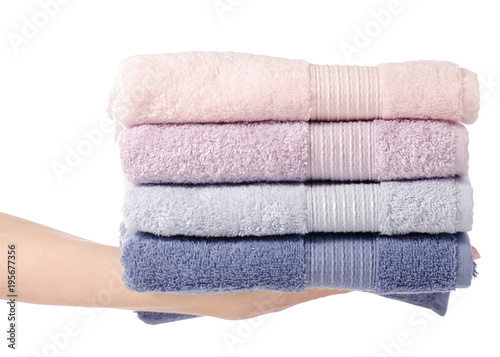 A stack of towels pink blue in hand