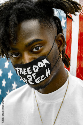 Young man wearing a freedom of speech mask over his mouth