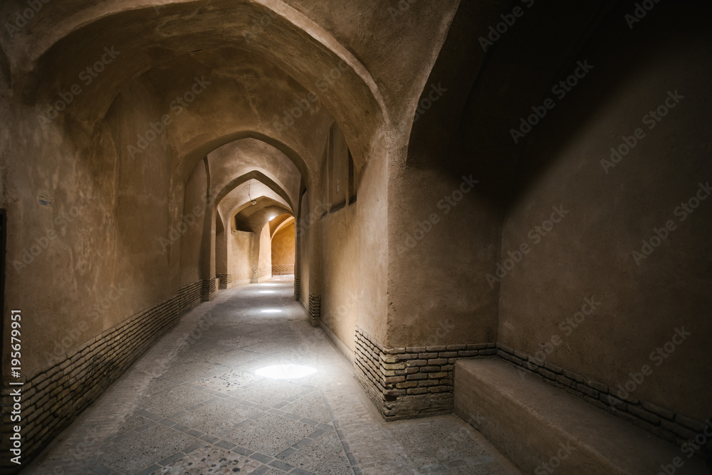illuminated alley through oldtown of yazd, iran illuminated alley through oldtown of yazd, iran