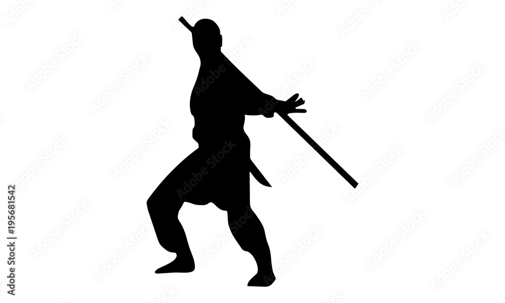 the silhouette of the male ninja acts with a stick