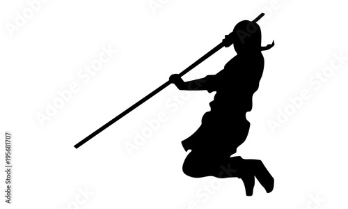 vector of the male ninja silhouette with a stick