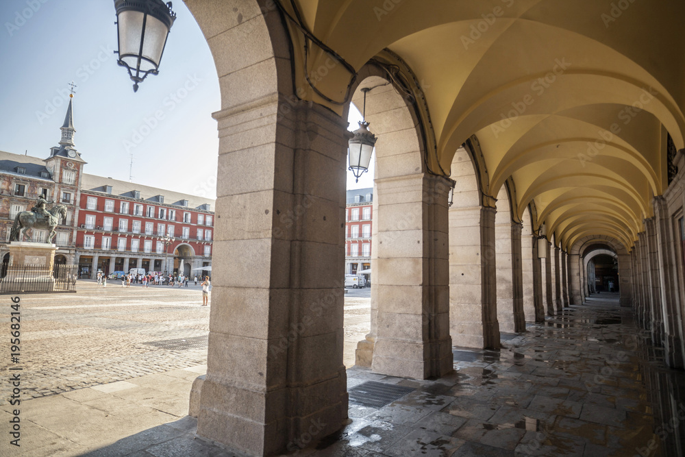 Arches and square, plaza mayor, iconic area, touristic point in historic center of Madrid.Spain.