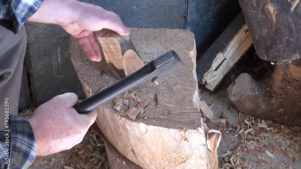 Chopping of wood with ax