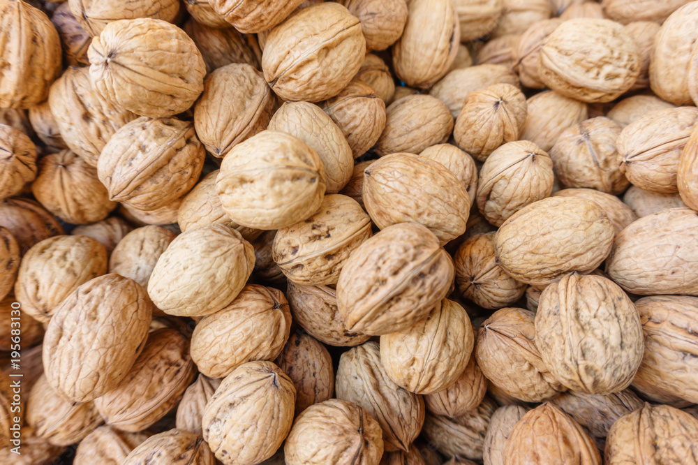 group of european walnuts in peel, natural food background group of european walnuts in peel, natural food background