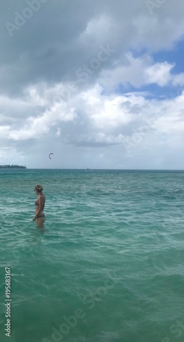 Beautiful view of the Nylon Pool at Caribbean island of Tobago (Trinidad - West Indies) from a boat: turquoise water and blue sky with white clouds