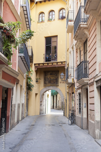 Ancient street view, historic center of Valencia, Spain. © joan_bautista