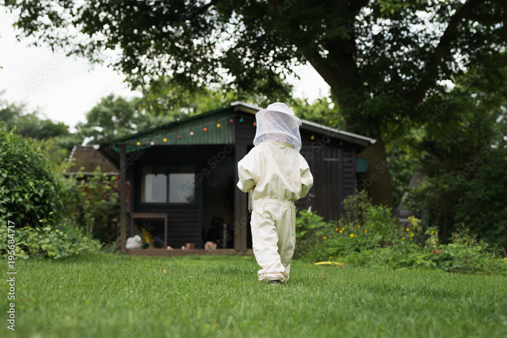Little apiarist from behind Little apiarist from behind