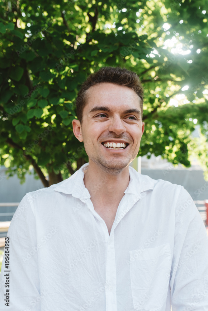 A young caucasian man posing for portraits