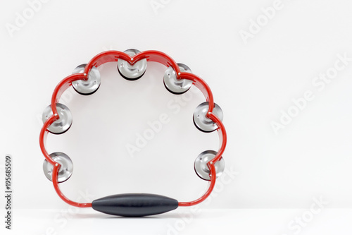 tambourine on the background of a white wall photo