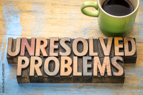 unresolved problems - word abstract in wood type
