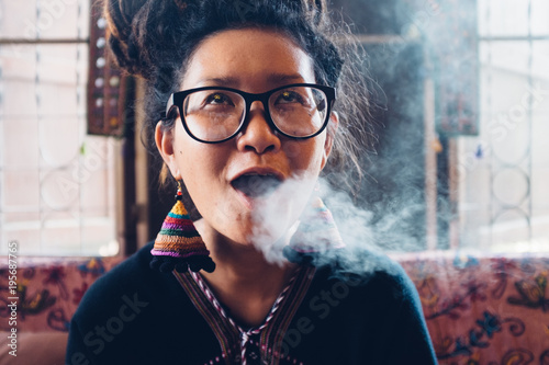 Funny Authentic Young Thai Woman With Dreadlocks Getting High